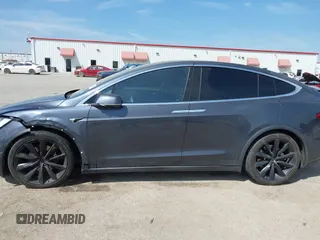 2017 Tesla Model X 90D with VIN 5YJXCBE22HF079194, listed as a IAAI auction lot 41895591 with 102,437 mi miles and . Bid and sale history available at DreamBid. Image 14.