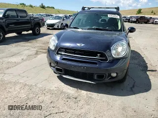 2016 MINI Countryman S with VIN WMWZC5C54GWT38489, listed as a Copart auction lot 63834335 with 102,564 mi miles and Salvage title. Bid and sale history available at DreamBid. Image 13.