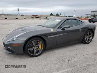2015 Ferrari California T z VIN ZFF77XJA3F0206563, wystawiony jako Copart lot #78976914 z przebiegiem Nie podano mil oraz Szkody całkowita. Historia ofert i sprzedaży dostępna na DreamBid. Obrazek 1.
