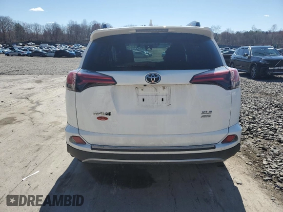 2018 Toyota RAV4 XLE with VIN 2T3RFREV8JW750032, listed as a Copart auction lot 53676475 with Not Provided miles and Salvage Title. Bid and sale history available at DreamBid. Image 6.
