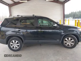2011 Kia Sorento LX with VIN 5XYKTDA24BG170561, listed as a IAAI auction lot 42011756 with 211,833 mi miles. Bid and sale history available at carsss.com. Image 13.