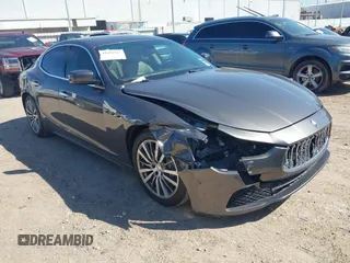 2015 Maserati Ghibli z VIN ZAM57XSA6F1153481, wystawiony jako IAAI lot #41694942 z przebiegiem 74 027 mil mil oraz . Historia ofert i sprzedaży dostępna na DreamBid. Obrazek 1.