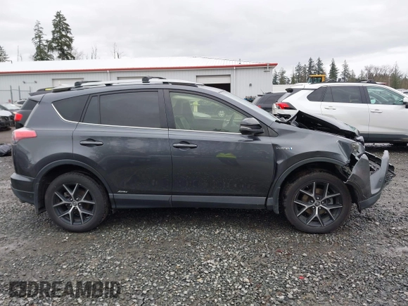 2018 Toyota RAV4 Hybrid SE with VIN JTMJJREV7JD208249, listed as a IAAI auction lot 41859301 with 91,899 mi miles and . Bid and sale history available at DreamBid. Image 13.