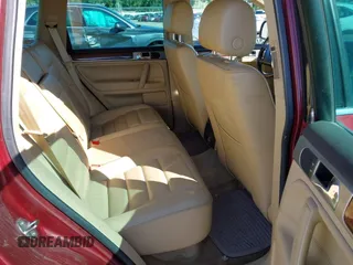 2004 Volkswagen Touareg z VIN WVGBC67L24D004600, wystawiony jako IAAI lot #42283582 z przebiegiem 192 135 mil mil oraz . Historia ofert i sprzedaży dostępna na DreamBid. Obrazek 8.