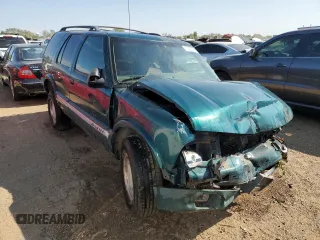 1996 GMC Jimmy SL with VIN 1GKCS13W0T2553905, listed as a Copart auction lot 71007674 with 169,513 mi miles and Salvage Title. Bid and sale history available at carsss.com. Image 4.
