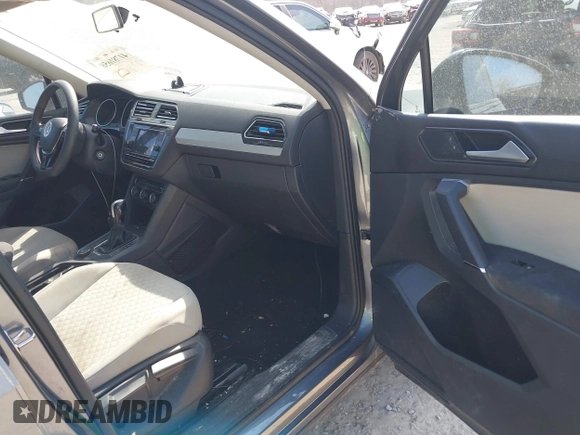 2018 Volkswagen Tiguan S with VIN 3VV0B7AX7JM104662, listed as a IAAI auction lot 41781658 with 235,461 mi miles and . Bid and sale history available at DreamBid. Image 5.