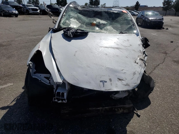 2023 Tesla Model Y Long Range z VIN 7SAYGDEE3PA077841, wystawiony jako Copart lot #54535215 z przebiegiem Nie podano mil oraz Szkoda całkowita • Salvage title. Historia ofert i sprzedaży dostępna na DreamBid. Obrazek 11.