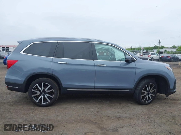 2022 Honda Pilot Touring 7-Passenger with VIN 5FNYF6H68NB056077, listed as a IAAI auction lot 42357338 with 18,193 mi miles and . Bid and sale history available at DreamBid. Image 13.