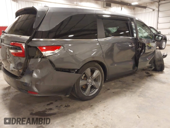 2021 Honda Odyssey Touring with VIN 5FNRL6H82MB025923, listed as a IAAI auction lot 42104290 with 61,178 mi miles and . Bid and sale history available at DreamBid. Image 4.