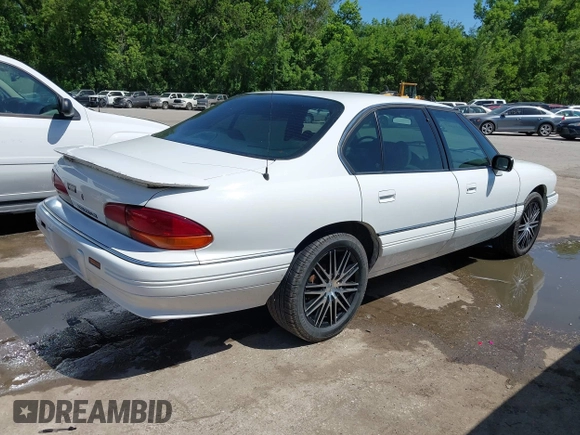 1993 Pontiac Bonneville SE z VIN 1G2HX53L8P1281104, wystawiony jako IAAI lot #42219547 z przebiegiem 113 292 mil mil oraz . Historia ofert i sprzedaży dostępna na DreamBid. Obrazek 4.