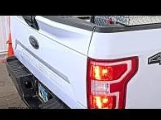 2019 Ford F-150 XL with VIN 1FTFX1E5XKKD00653, listed as a IAAI auction lot 42130822 with 208,066 mi miles. Bid and sale history available at carsss.com. Image 1.