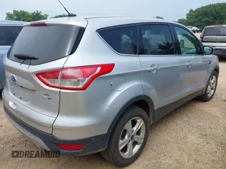 2014 Ford Escape SE with VIN 1FMCU9GX9EUB15619, listed as a IAAI auction lot 42603542 with 188,454 mi miles and . Bid and sale history available at DreamBid. Image 4.