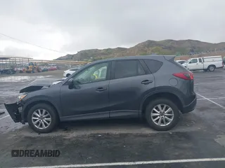2016 Mazda CX-5 Touring with VIN JM3KE2CY7G0630056, listed as a IAAI auction lot 41817525 with 97,844 mi miles and . Bid and sale history available at DreamBid. Image 14.