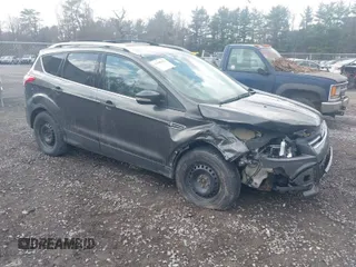 2016 Ford Escape Titanium with VIN 1FMCU9J91GUA34756, listed as a IAAI auction lot 41909171 with 102,804 mi miles. Bid and sale history available at carsss.com. Image 1.