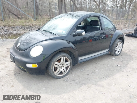 2004 Volkswagen New Beetle Coupe GL with VIN 3VWBK31CX4M416912, listed as a IAAI auction lot 42125377 with 999,999 mi miles. Bid and sale history available at carsss.com. Image 2.