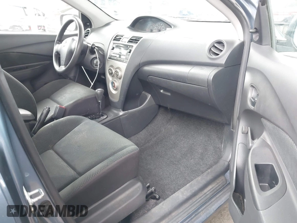 2009 Toyota Yaris with VIN JTDBT903791302911, listed as a IAAI auction lot 42181264 with 183,321 mi miles. Bid and sale history available at carsss.com. Image 5.