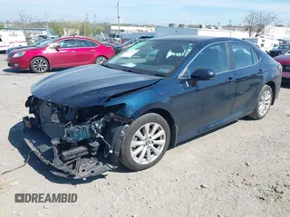 2019 Toyota Camry LE with VIN 4T1B11HK3KU254083, listed as a IAAI auction lot 42091530 with 26,635 mi miles and . Bid and sale history available at DreamBid. Image 2.