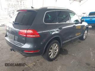 2014 Volkswagen Touareg Sport with VIN WVGEF9BP0ED015273, listed as a IAAI auction lot 42046823 with 84,694 mi miles and . Bid and sale history available at DreamBid. Image 4.
