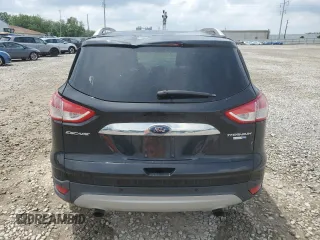 2015 Ford Escape Titanium with VIN 1FMCU9J91FUA38787, listed as a Copart auction lot 59749735 with 132,536 mi miles and Salvage title. Bid and sale history available at DreamBid. Image 6.