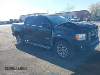2015 GMC Canyon 4WD SLE z VIN 1GTG6BE31F1154389, wystawiony jako IAAI lot #42124824 z przebiegiem 121 927 mil mil oraz . Historia ofert i sprzedaży dostępna na DreamBid. Obrazek 1.