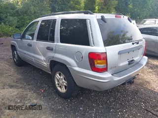 2002 Jeep Grand Cherokee Laredo z VIN 1J4GW48S62C261154, wystawiony jako IAAI lot #42602424 z przebiegiem 160 295 mil mil oraz . Historia ofert i sprzedaży dostępna na DreamBid. Obrazek 3.