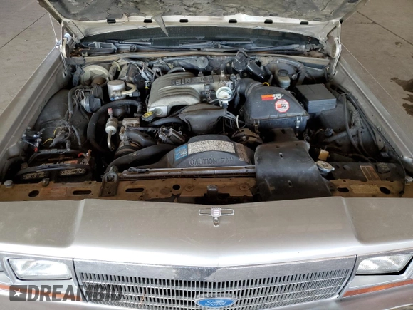 1990 Ford Crown Victoria z VIN 2FACP73F9LX166174, wystawiony jako Copart lot #76043234 z przebiegiem 52 545 mil mil oraz Szkoda całkowita • Salvage title. Historia ofert i sprzedaży dostępna na DreamBid. Obrazek 11.