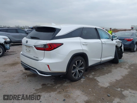 2018 Lexus RX 350L Premium z VIN JTJDZKCAXJ2010125, wystawiony jako IAAI lot #41899420 z przebiegiem 113 995 mil mil oraz . Historia ofert i sprzedaży dostępna na DreamBid. Obrazek 4.