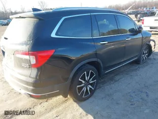 2019 Honda Pilot Touring 7-Passenger with VIN 5FNYF6H65KB061796, listed as a IAAI auction lot 41650857 with 122,417 mi miles. Bid and sale history available at carsss.com. Image 4.