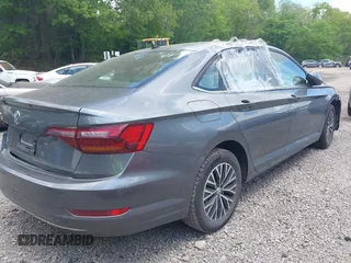 2019 Volkswagen Jetta S z VIN 3VWC57BUXKM121316, wystawiony jako IAAI lot #42290107 z przebiegiem 117 371 mil mil oraz . Historia ofert i sprzedaży dostępna na DreamBid. Obrazek 4.