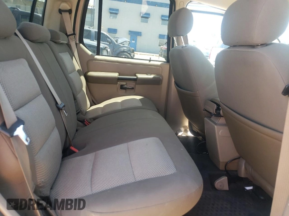 2004 Ford Explorer Sport Trac XLS z VIN 1FMZU67K34UC40112, wystawiony jako Copart lot #57877855 z przebiegiem 139 350 mil mil oraz Szkoda całkowita • Salvage title. Historia ofert i sprzedaży dostępna na DreamBid. Obrazek 10.