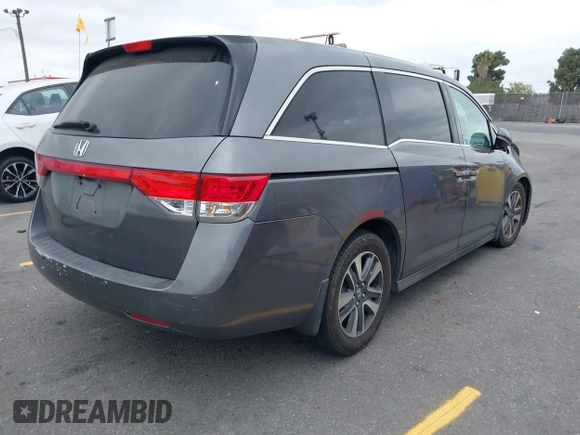 2014 Honda Odyssey Touring with VIN 5FNRL5H97EB114634, listed as a IAAI auction lot 42105220 with Not Provided miles and . Bid and sale history available at carsss.com. Image 4.