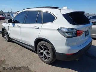 2016 BMW X1 xDrive28i with VIN WBXHT3C32G5E51855, listed as a IAAI auction lot 41634237 with 69,101 mi miles. Bid and sale history available at carsss.com. Image 3.