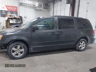2012 Dodge Grand Caravan SXT with VIN 2C4RDGCG7CR358266, listed as a IAAI auction lot 41582428 with 169,137 mi miles and . Bid and sale history available at DreamBid. Image 14.
