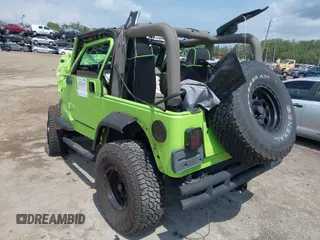 2004 Jeep Wrangler Sahara z VIN 1J4FA59S44P704878, wystawiony jako IAAI lot #42226255 z przebiegiem 88 886 mil mil oraz . Historia ofert i sprzedaży dostępna na DreamBid. Obrazek 3.