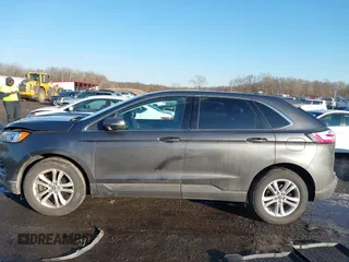 2019 Ford Edge SEL z VIN 2FMPK4J94KBB07837, wystawiony jako IAAI lot #41347294 z przebiegiem 90 668 mil mil oraz . Historia ofert i sprzedaży dostępna na DreamBid. Obrazek 14.