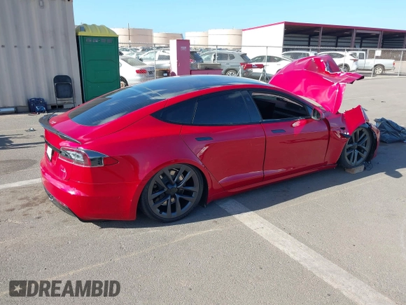 2022 Tesla Model S Plaid with VIN 5YJSA1E61NF460253, listed as a IAAI auction lot 40328727 with Not provided miles and . Bid and sale history available at DreamBid. Image 4.