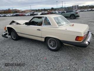 1986 Mercedes-Benz 560 SL with VIN WDBBA48D9GA042092, listed as a Copart auction lot 82438564 with 43,758 mi miles and Salvage Title. Bid and sale history available at DreamBid. Image 2.