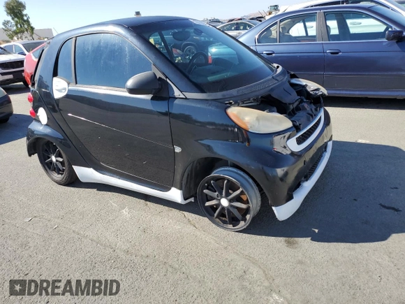 2009 Smart fortwo Pure z VIN WMEEJ31X49K253051, wystawiony jako Copart lot #70193934 z przebiegiem Nie podano mil oraz Szkody całkowita. Historia ofert i sprzedaży dostępna na DreamBid. Obrazek 4.