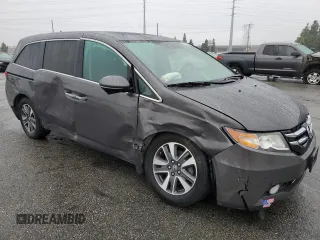 2016 Honda Odyssey Touring Elite with VIN 5FNRL5H97GB090094, listed as a Copart auction lot 50545285 with 158,334 mi miles and Salvage Title. Bid and sale history available at DreamBid. Image 4.