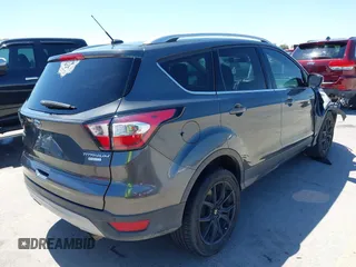 2017 Ford Escape Titanium with VIN 1FMCU0J97HUE07747, listed as a IAAI auction lot 41977788 with 104,560 mi miles. Bid and sale history available at carsss.com. Image 4.