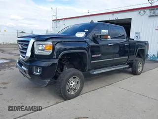 2015 GMC Sierra 2500HD SLT with VIN 1GT12ZE87FF552599, listed as a IAAI auction lot 40054977 with 146,190 mi miles and . Bid and sale history available at DreamBid. Image 2.