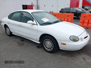 1997 Ford Taurus LX with VIN 1FALP53S0VG291879, listed as a IAAI auction lot 42498197 with 266,886 mi miles and . Bid and sale history available at DreamBid. Image 1.