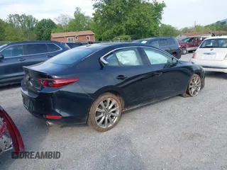 2021 Mazda 3 Premium z VIN 3MZBPADL2MM254467, wystawiony jako IAAI lot #42151557 z przebiegiem 63 282 mil mil oraz . Historia ofert i sprzedaży dostępna na DreamBid. Obrazek 4.