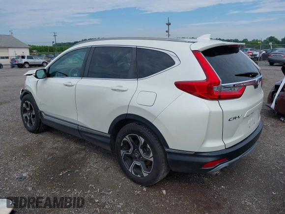 2018 Honda CR-V Touring with VIN 2HKRW2H91JH665241, listed as a IAAI auction lot 42638694 with 62,066 mi miles and . Bid and sale history available at DreamBid. Image 3.