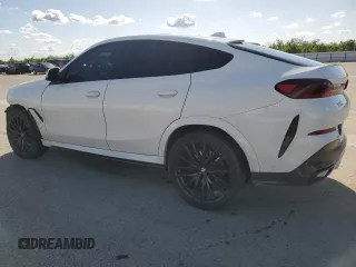 2023 BMW X6 xDrive40i z VIN 5UXCY6C04P9P49005, wystawiony jako Copart lot #51974695 z przebiegiem 30 421 mil mil oraz Szkoda całkowita • Salvage title. Historia ofert i sprzedaży dostępna na DreamBid. Obrazek 2.