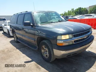 2004 Chevrolet Suburban LT z VIN 1GNEC16Z04J163697, wystawiony jako IAAI lot #42267114 z przebiegiem 245 186 mil mil oraz . Historia ofert i sprzedaży dostępna na DreamBid. Obrazek 1.