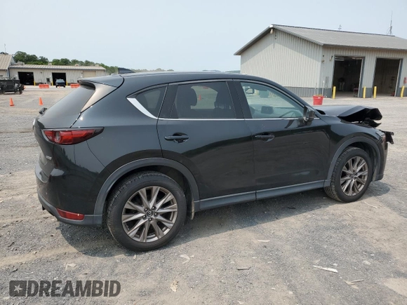 2019 Mazda CX-5 Grand Touring with VIN JM3KFBDM2K0569829, listed as a Copart auction lot 59060965 with 99,359 mi miles and Salvage title. Bid and sale history available at DreamBid. Image 3.