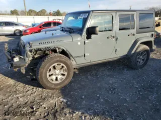 2015 Jeep Wrangler Unlimited Rubicon with VIN 1C4BJWFG7FL732694, listed as a Copart auction lot 42977435 with 128,759 mi miles and Salvage Title. Bid and sale history available at carsss.com. Image 1.