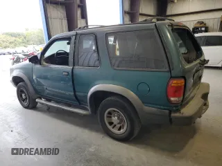 1998 Ford Explorer Sport with VIN 1FMYU22X4WUB36948, listed as a Copart auction lot 76699374 with 266,977 mi miles and Salvage title. Bid and sale history available at DreamBid. Image 2.