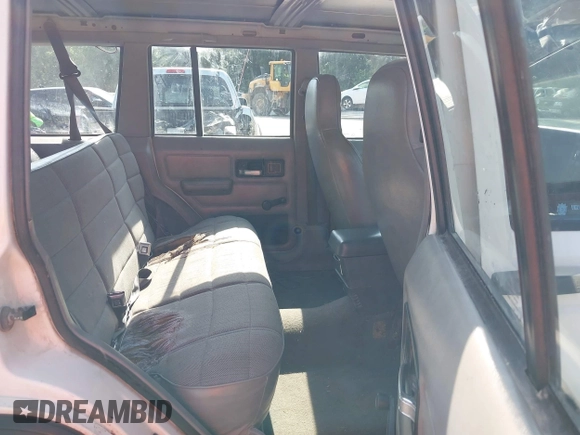 1996 Jeep Cherokee Sport z VIN 1J4FJ68S3TL226188, wystawiony jako IAAI lot #42460538 z przebiegiem 217 118 mil mil oraz . Historia ofert i sprzedaży dostępna na DreamBid. Obrazek 8.